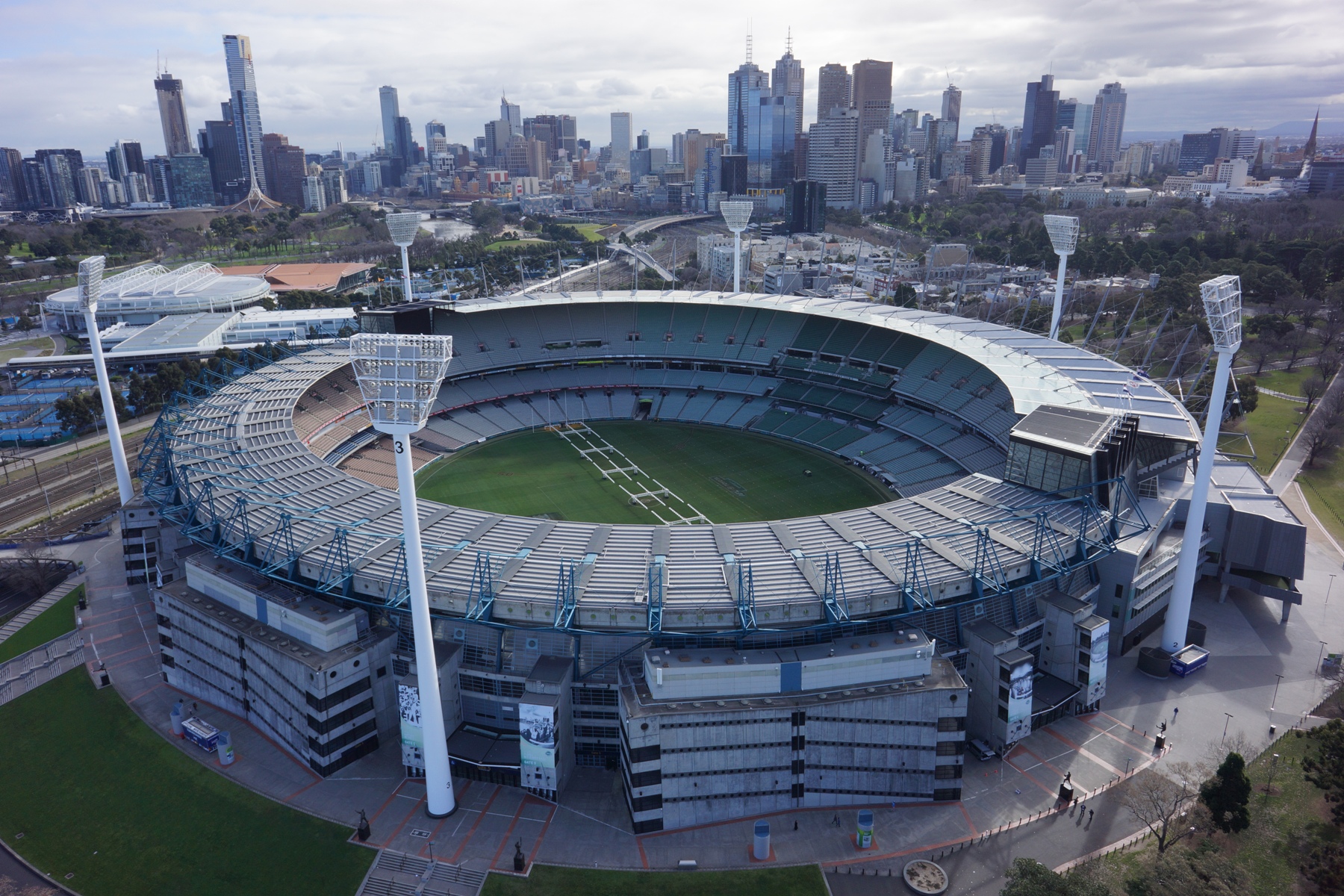 Aerial view of the Melbourne Cricket Ground (MCG) and surrounding cityscape, showcasing RISSafety's height safety solutions.