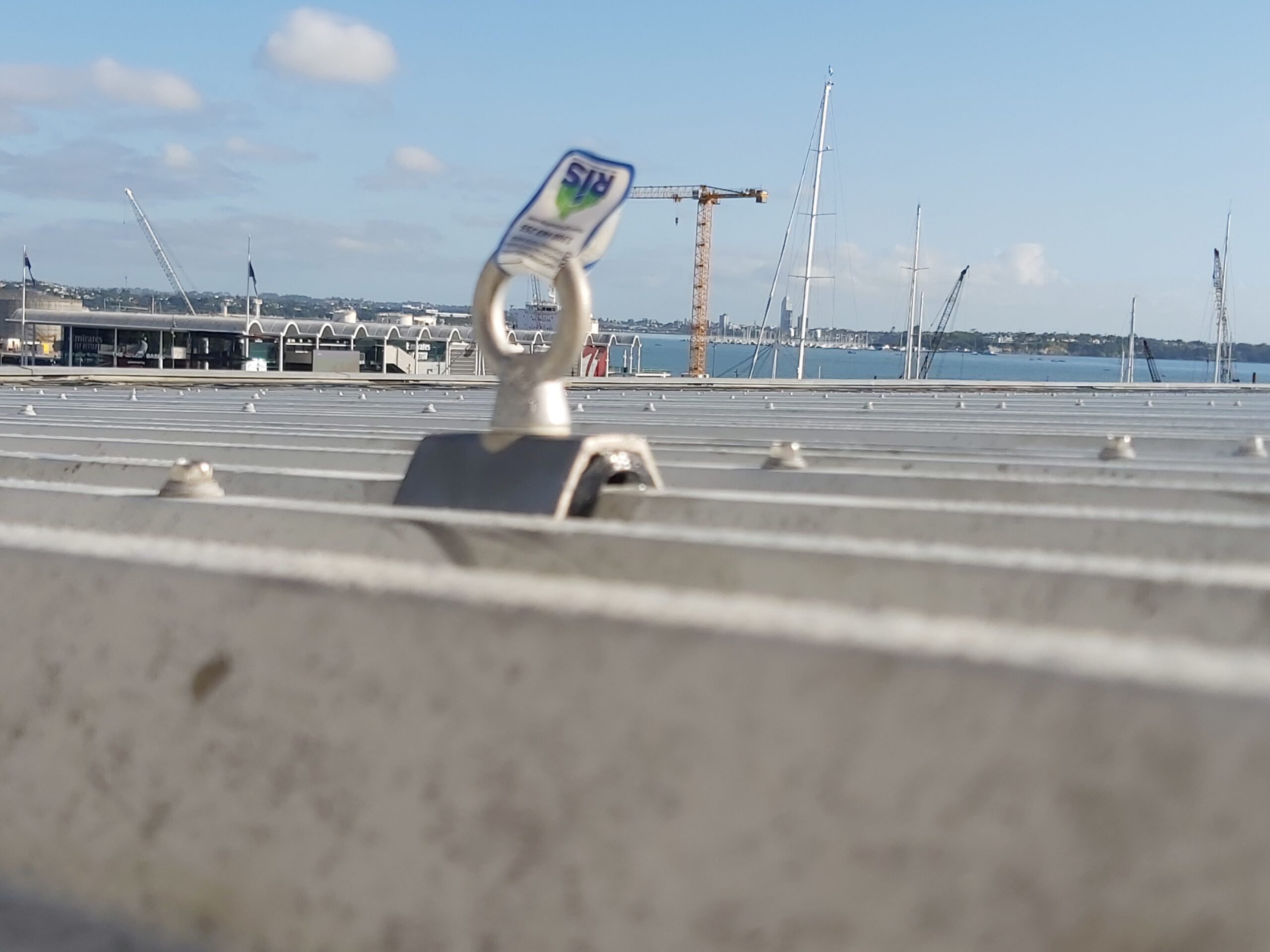 RISSafety roof anchor point on Auckland apartment building rooftop and skyline