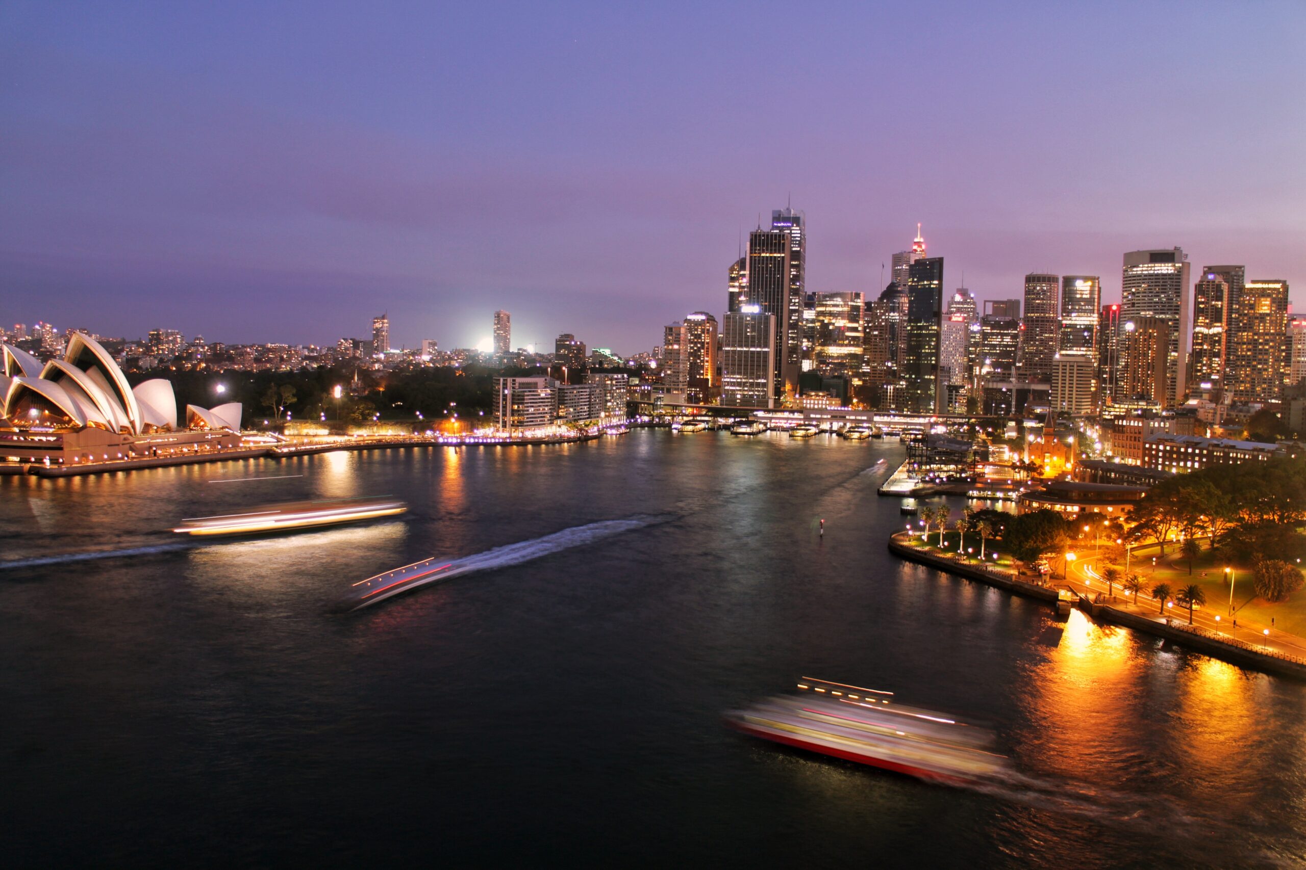 Sydney cityscape and harbour with boats, illustrating facility management responsibilities for building safety.