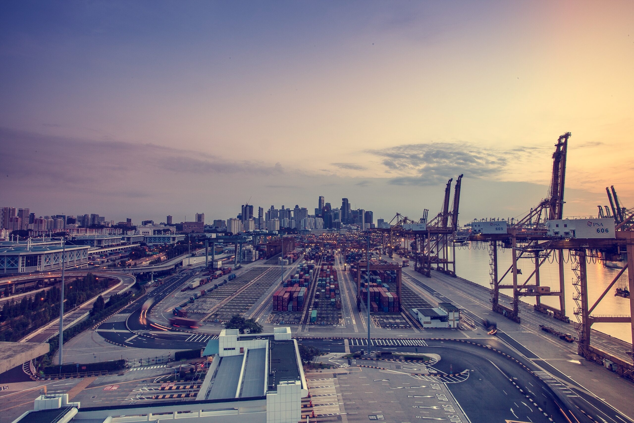 City skyline and port cranes illustrating civil construction and height safety solutions.
