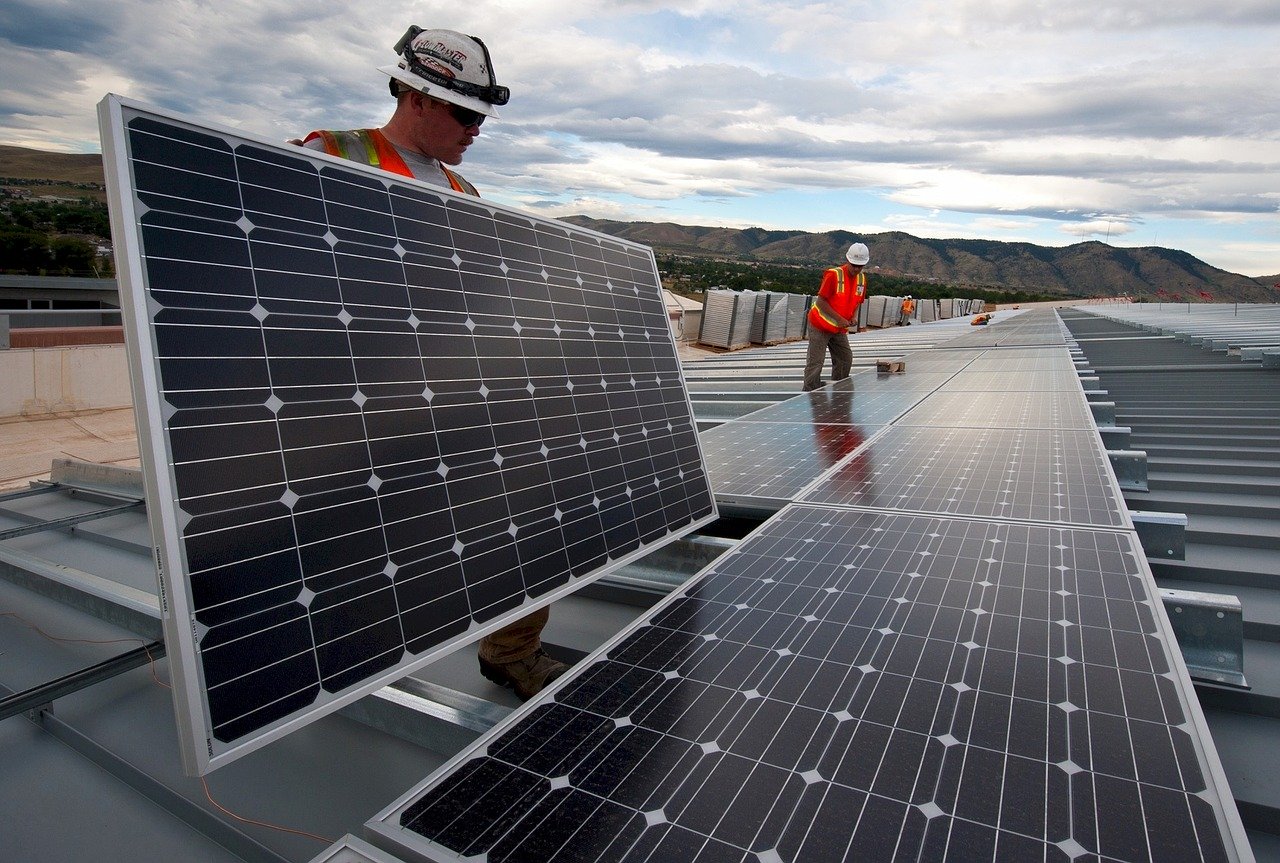 men installing solar panels