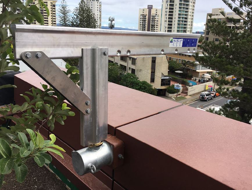 Custom-designed Davit Arm solution on Jewel Residences façade for safe rope access.