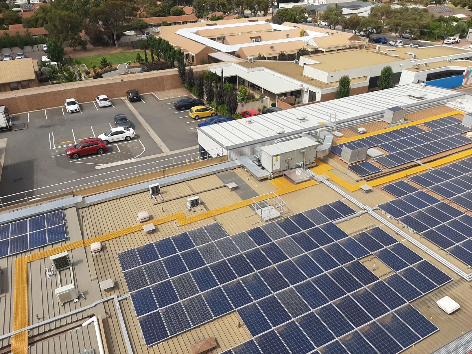 RISSafety office building with solar panels and parking area