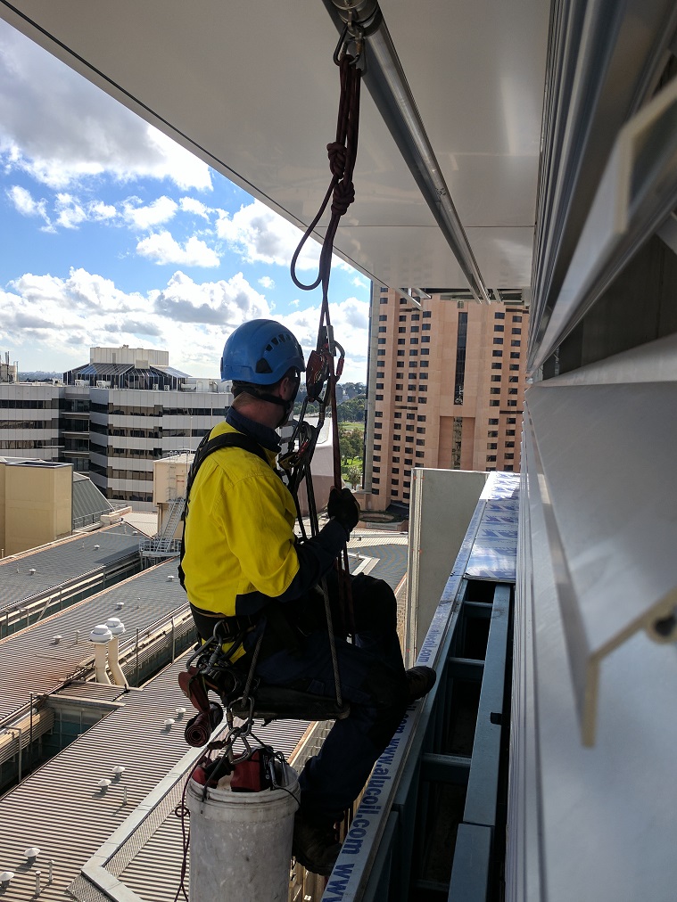RISSafety aluminium strong rail fall protection system in use at Holiday Inn, demonstrating workplace safety protocols.