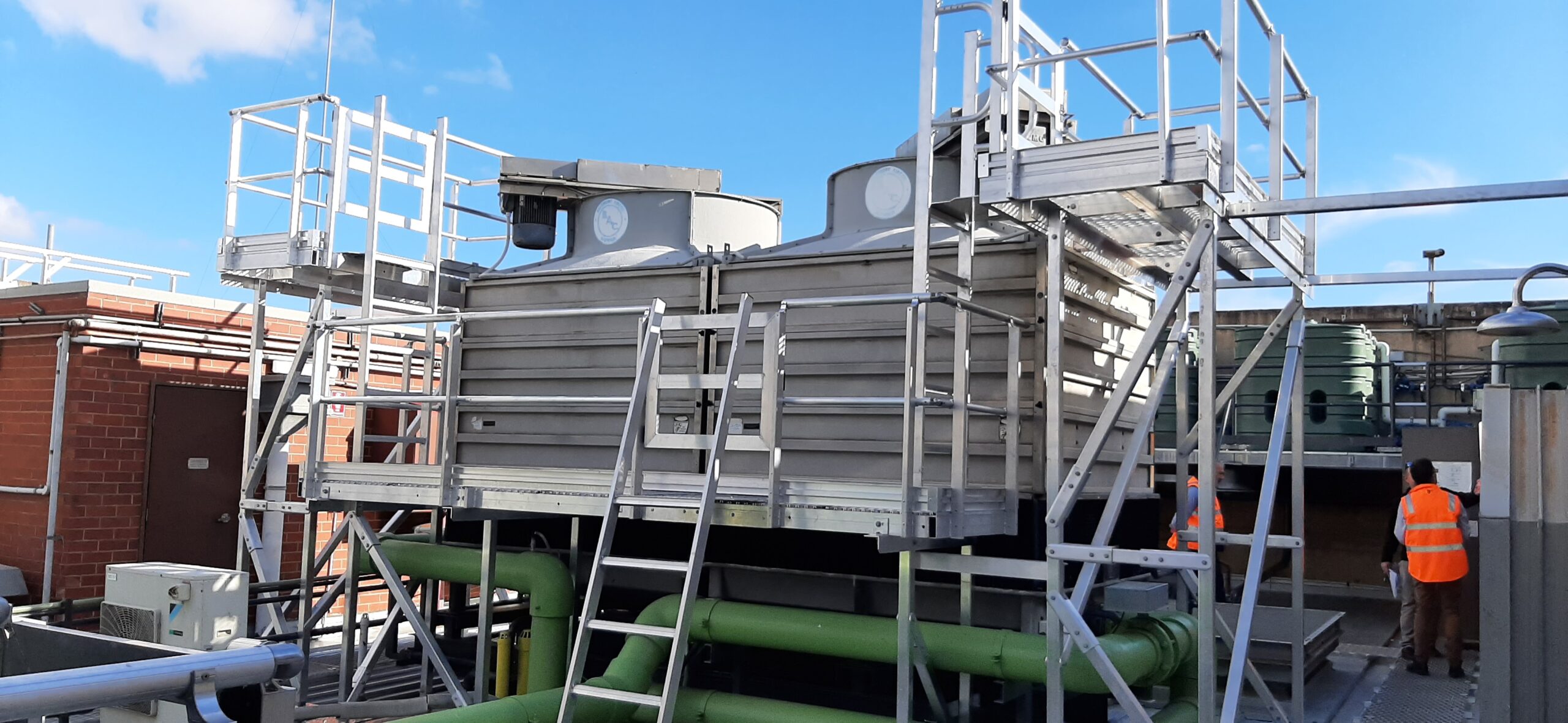 RISSafety height safety equipment and scaffolding on industrial rooftop cooling system