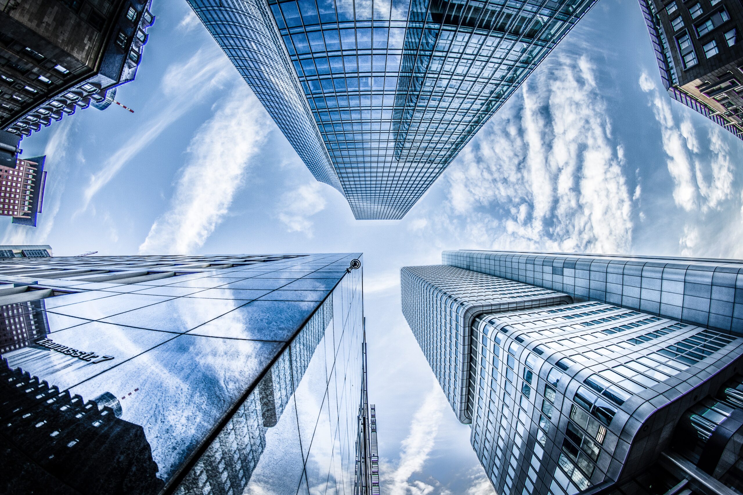High-rise buildings and curtain wall construction illustrating workplace height safety inspections.