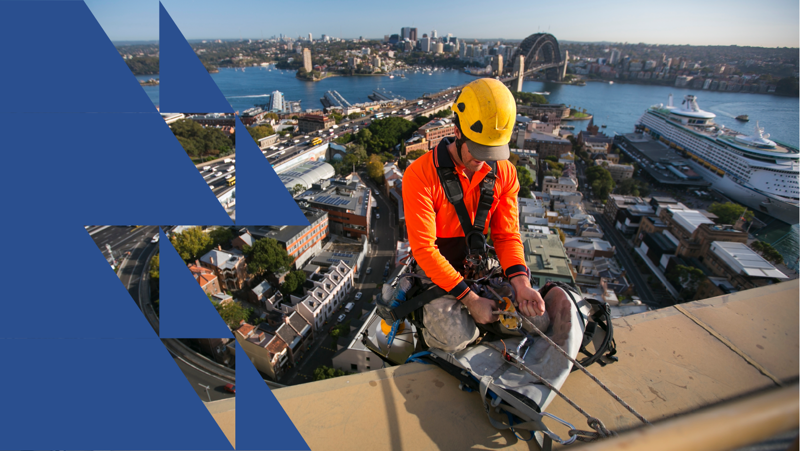Construction worker wearing height safety harness and helmet on Sydney Harbour rooftop, illustrating workplace safety and fall prevention.