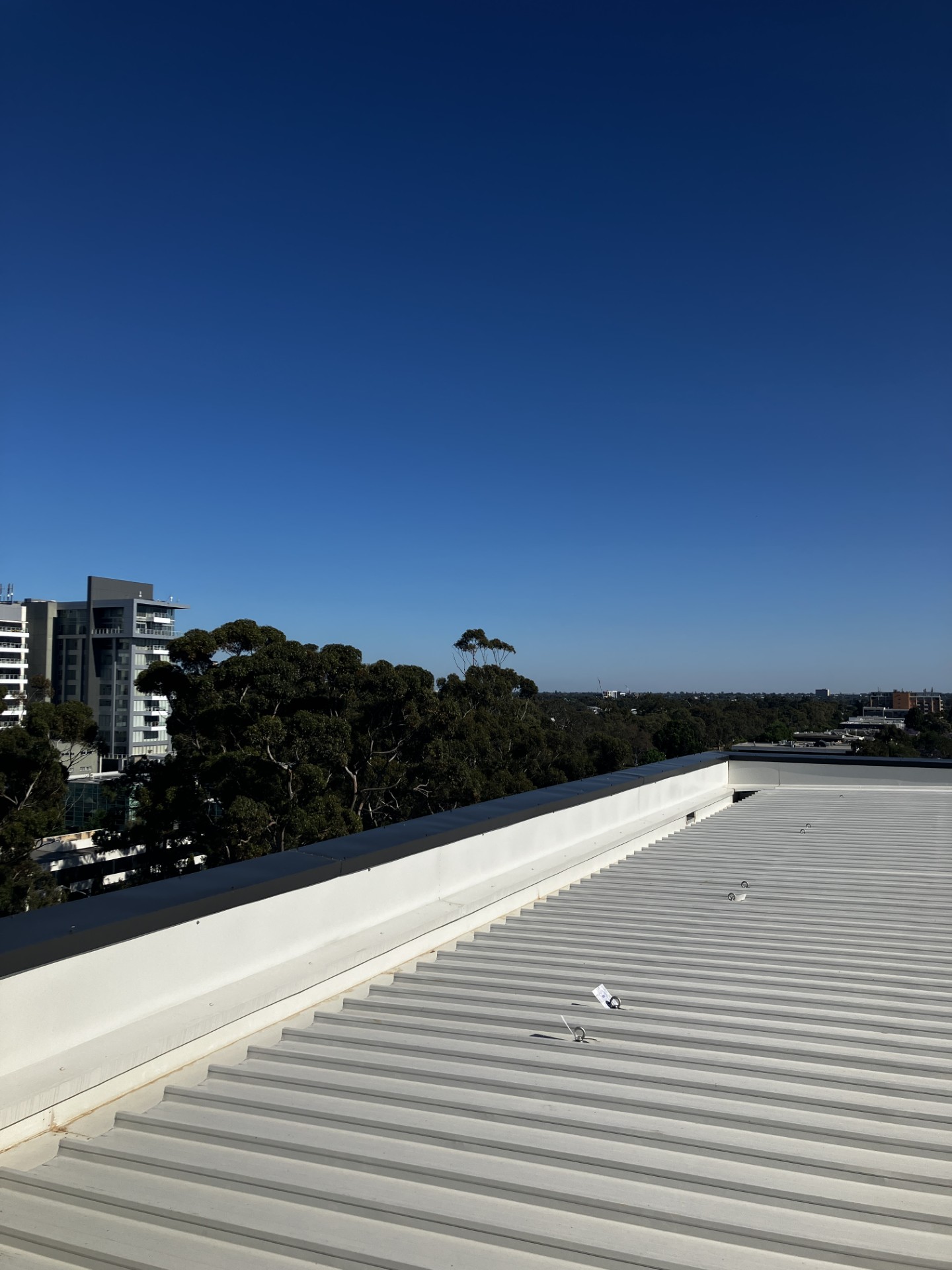 Rooftop safety systems and anchor points on Bloom Glenside apartment building roof.
